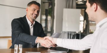 Business, career and placement concept - joyful handsome busines