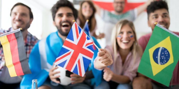 Group of multi-ethnic people celebrating football game