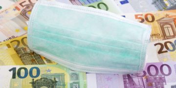 Protective mask on a Swiss money background