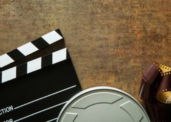 Clapper board with film reel.