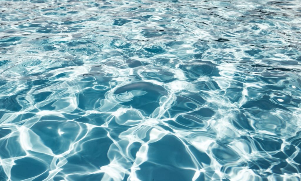Clear shiny and warm blue water in the pool