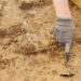 Archeological tools, Archeologist working on site, hand and tool.