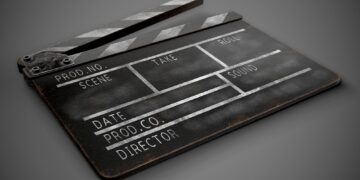 Clapperboard on a dark background close-up.