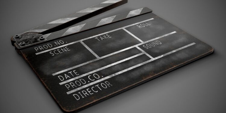 Clapperboard on a dark background close-up.