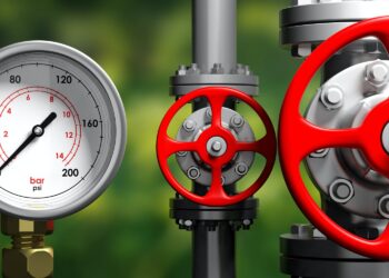 Industrial manometer, pipelines and valves on blur green background, 3d illustration