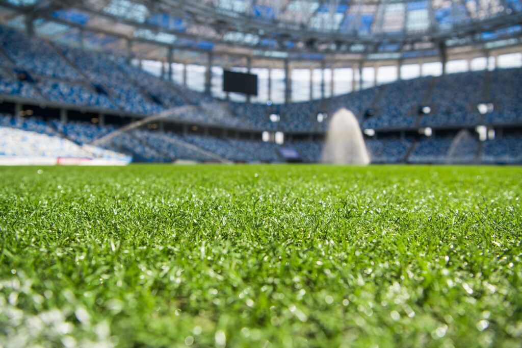 Irrigation turf. Sprinkler watering football field.