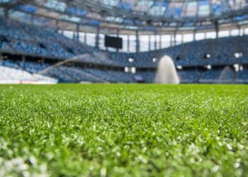 Irrigation turf. Sprinkler watering football field.