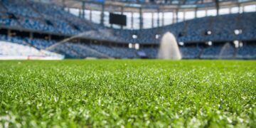 Irrigation turf. Sprinkler watering football field.