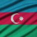 Azerbaijan flag is depicted on a sports cloth fabric with many folds. Sport team waving banner