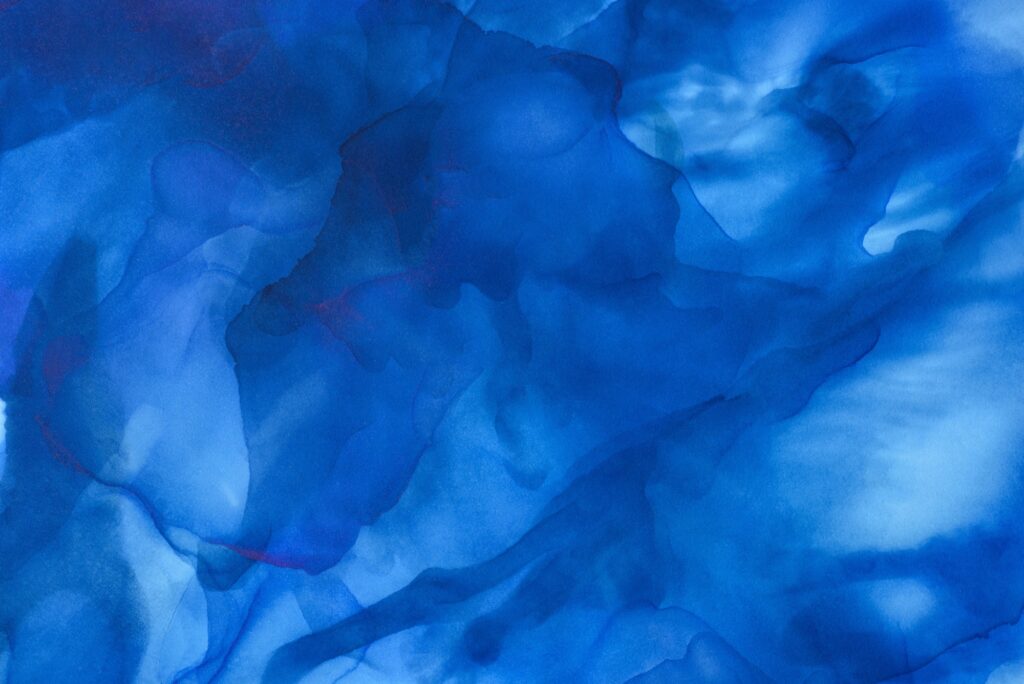 dark blue splashes of alcohol ink as abstract background