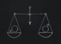 Drawn scales with male and female gender symbols