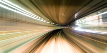 Fast train passing by train station