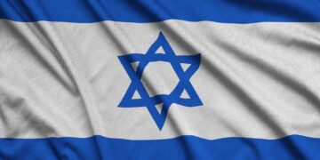 Israel flag is depicted on a sports cloth fabric with many folds. Sport team waving banner