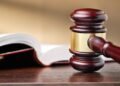 Judges wooden gavel and law book