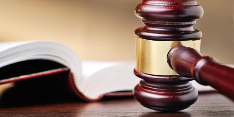 Judges wooden gavel and law book