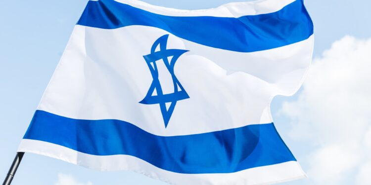 low angle view of national israel flag with star of david against blue sky