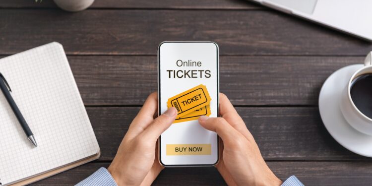 Man Using Application for Buying Tickets Online On Smartphone