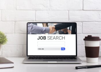 Pc on the desk with job search engine on display