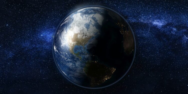 Planet Earth in black and blue Universe of stars