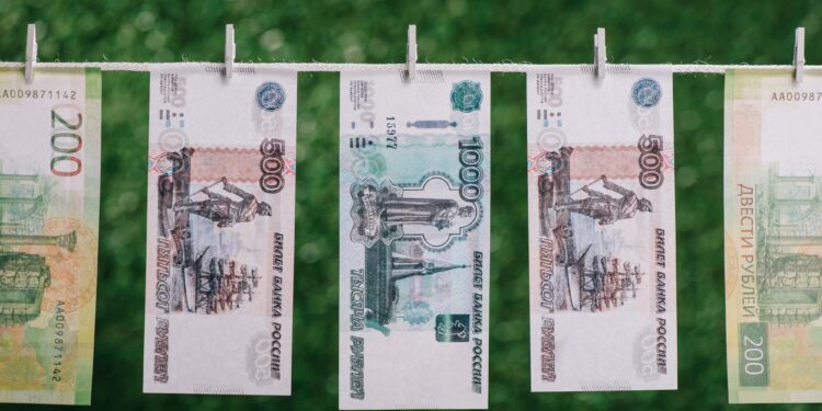 rubles banknotes hanging with clothespins on clothesline, money laundering concept