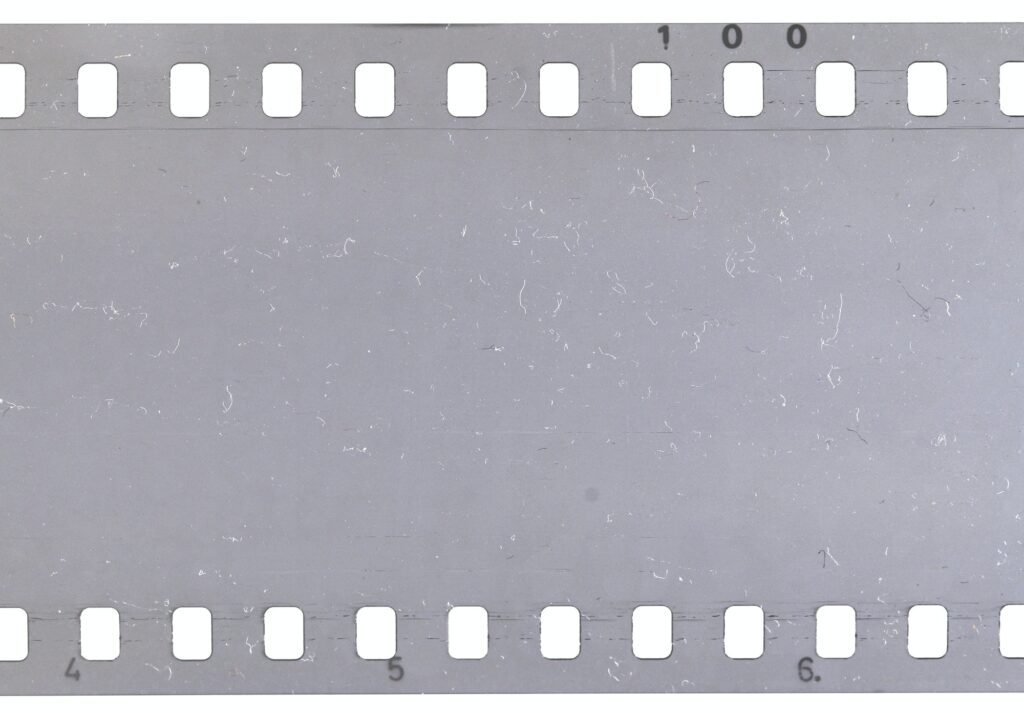 Strip of old celluloid film with dust and scratches