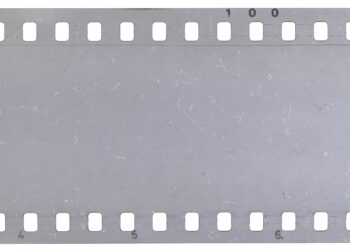 Strip of old celluloid film with dust and scratches