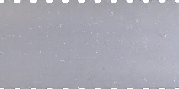 Strip of old celluloid film with dust and scratches