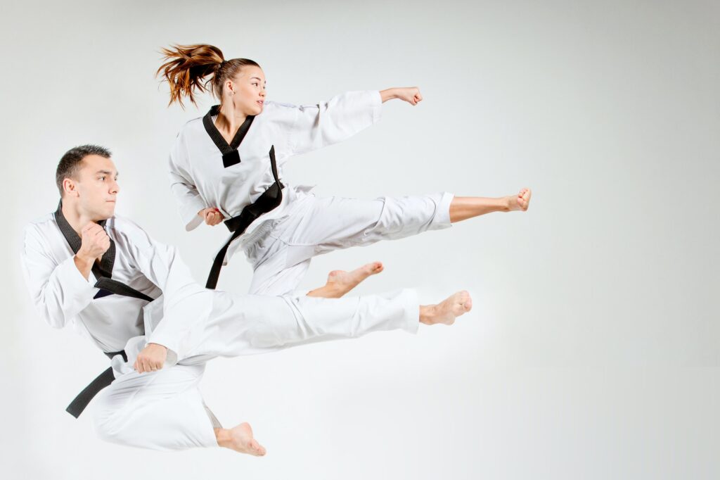 The karate girl and man with black belts