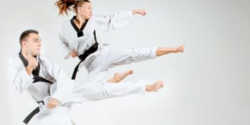 The karate girl and man with black belts