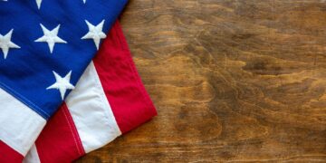 USA flag, US of America sign symbol on wood, top view