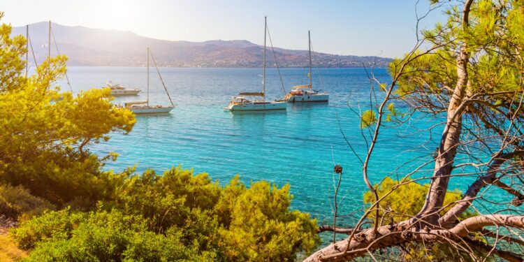 View of an emerald and transparent mediterranean sea with yachts