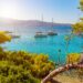 View of an emerald and transparent mediterranean sea with yachts
