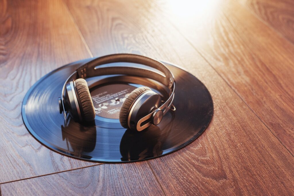 vinyl record and headphone over wooden table. Audio enthusiast,music lover or professional disc